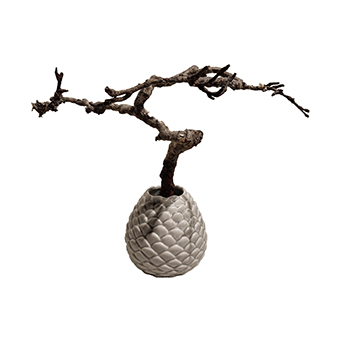  textured vase green with a branch in it